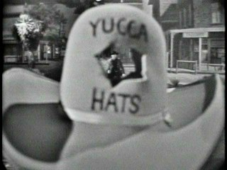 Movie studios try to liven up the Western with this through-the-hat shot.