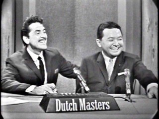 Ernie Kovacs and mystery guest Daniel Inouye (the future and still U.S. Senator from Hawaii) have a laugh on "Take a Good Look."