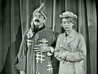 Ernie Kovacs is magician Matzoh Hepplewhite and wife Edie Adams is his assistant/volunteer in this Disc 2 bonus morning show sketch.