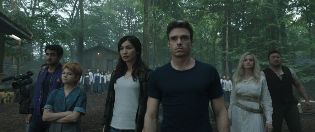 Marvel's Eternals in the woods: Kingo (Kumail Nanjiani), Sprite (Lia McHugh), Sersi (Gemma Chan), Ikaris (Richard Madden), Thena (Angelina Jolie), and Gilgamesh (Don Lee).