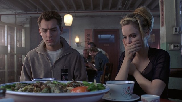 Ted Pikul (Jude Law) and Allegra Geller (Jennifer Jason Leigh) have their regrets about ordering a Chinese restaurant's special.