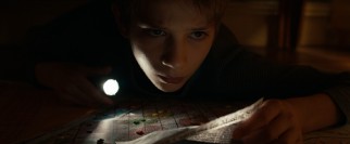 Oskar (Thomas Horn) plots his big adventure in secret, and sometimes in the darkness under his bed.