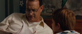 Flashback scenes paint German American jeweler Thomas Schell (Tom Hanks) as the perfect Dad to his son.
