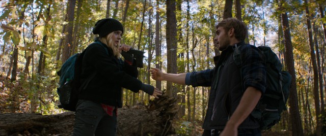 Evan Walker (Alex Roe) shows Cassie Sullivan (Chlo Grace Moretz) how to disarm in "The 5th Wave."
