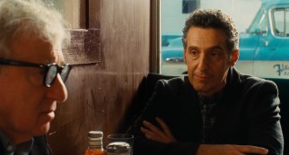 Fioravante (John Turturro) considers his future at a table with Murray (Woody Allen).