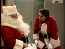 The apparently real Santa Claus gives mall version Alex (Michael J. Fox) an assist in the heartwarming Christmas episode "Miracle in Columbus."