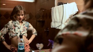 Lucinda (Joey King) tries her Taxi Driver act out in front of the mirror and a bottle of Listerine.