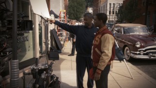 Denzel Washington directs Jovan Adepo in a period-inauthentic Adidas track suit.