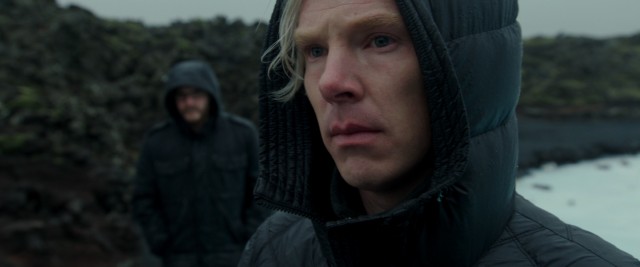 Julian Assange (Benedict Cumberbatch) is briefly alone with his thoughts as his right hand man Daniel approaches.
