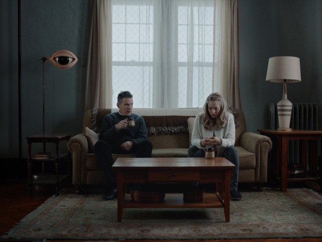 In "First Reformed", Reverend Ernst Toller (Ethan Hawke) counsels troubled parishioner Mary (Amanda Seyfried).