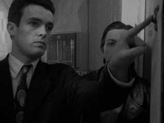 Bill looks on as Cobb (Alex Haw) shows him the ropes of home burglary.