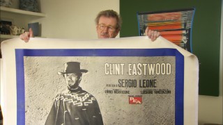 Christopher Frayling shows off one of his many beloved "For a Few Dollars More" posters.