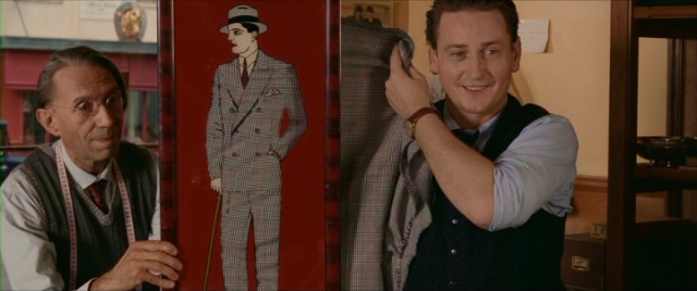 Suit maker and salesman Michel Korsky (Benot Magimel) uses a see-through display to shows a client what a suit will look like in Diane Kurys' "For a Woman."
