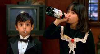 With a cigarette and champagne, unsupervised kids Juancho (Danny Verduzco) and Sarah (Lana McKissack) live up to the title of their Robert Rodriguez segment, "The Misbehavers."