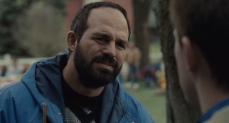 Older brother Dave Schultz (a balding Mark Ruffalo) rejects Mark's offer to join him at Foxcatcher.