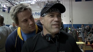 A blonde frosted Channing Tatum creeps up behind the real Mark Schultz on the set of "Foxcatcher."