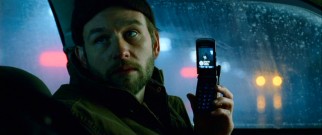 The psycho prostitute killer Carl (Dallas Roberts) shows off a state-of-the-art camera phone, circa early 2008.