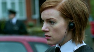 Officer Ferrington (Niamh McGrady) expresses guilt over the murder she failed to prevent.