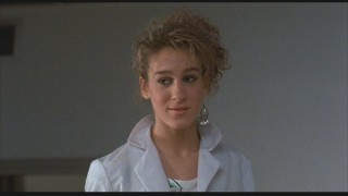A young Sarah Jessica Parker plays a friendly worker at the NASA base.