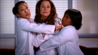 Dr. Dixon (Mary McDonnell) becomes the center of an awkward group hug with Cristina (Sandra Oh) and Bailey (Chandra Wilson) in "Beat Your Heart Out."