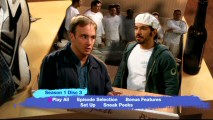 Gary's friend and fellow painter Dennis (Al Madrigal) share a moment on the pop-up pizza box of Disc 3's main menu.
