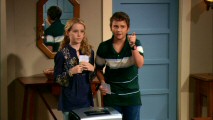 Louise (Kathryn Newton) and Tommy (Ryan Malgarini) get their parents' attention by holding Michael Bolton and Bruce Springsteen tickets above a paper shredder.