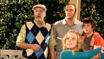 Charlie, Gary, and Tommy are amazed by how far Louise's first golf club swing drives the ball.