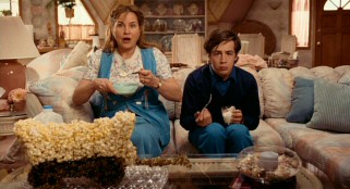 Judith (Jennifer Coolidge) and her son have different reactions to a local TV report on a movie adaptation of his story.
