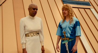 Amateur movie producer Lonnie Donaho (Hector Jimenez) casts himself as a bald female and Benjamin's "guardian angel" Dusty Crissop (Mike White) as Bronco in his no-budget VHS adaptation of "Yeast Lords."