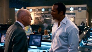 The Chief (Alan Arkin) has a talk with Agent 23 (Dwayne Johnson, hold "The Rock") about stapling.