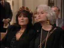 Dorothy and her sister-in-law mourn at Phil's funeral.