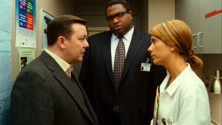 In a narrow supply closet, Dr. Pincus has to squeeze answers out of his reticent surgeon (Kristen Wiig) and the hospital's lawyer (Michael-Leon Wooley).