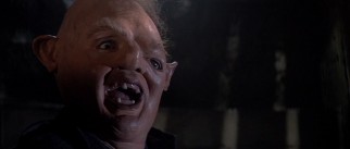 The basement-confined third Fratelli son, Sloth (John Matuszak), is not easy on the eyes.