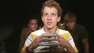 Rusty (Jacob Zachar) finds out that being a pledge involves several unpleasant experiences, including a spotlight interrogation with Chinese finger traps.