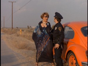 Mrs. C (Marion Ross) gets repeatedly pestered by Officer Tad (Jim Ritz) in "Grand Theft Auto."