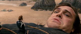 Gulliver (Jack Black) awakens in Lilliput tied down and with the surprising sight of a tiny general on his chest.