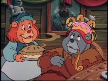 Stuffed and unhappy amidst birthday bakery items? That can't be the real Tummi in "If I Were You."