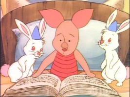 Piglet engages Rabbit's relatives with a little reading in bed in "Party Poohper."