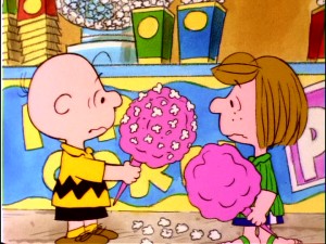 Peppermint Patty reconsiders adding popcorn to her cotton candy after looking at the unappealing results of the mixture she's made Charlie Brown.
