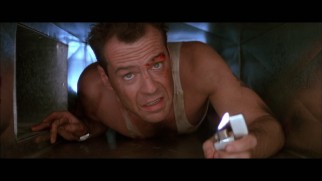 "Maximum McClane" recalls the better times in the Die Hard franchise like this lighter-lit crawl through the vents from the first film.