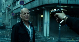 It's gonna take more than a gun pointed as his head to rattle John McClane (Bruce Willis).
