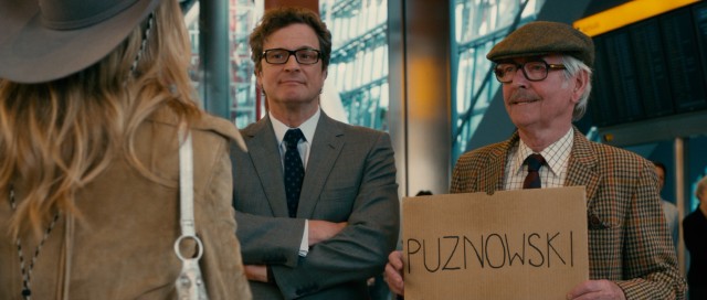 Harry Deane (Colin Firth) and Major Nigel Nelson Wingate (Tom Courtenay) greet their American accomplice at London's Heathrow Airport.