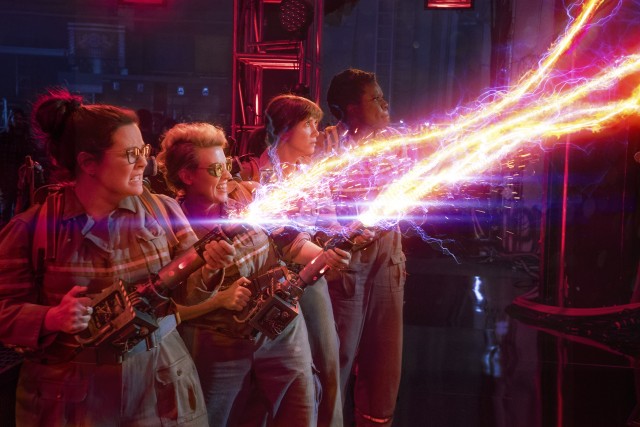 The Ghostbusters (Melissa McCarthy, Kate McKinnon, Kristen Wiig, and Leslie Jones) use their proton packs to combat the ghosts terrorizing New York City.