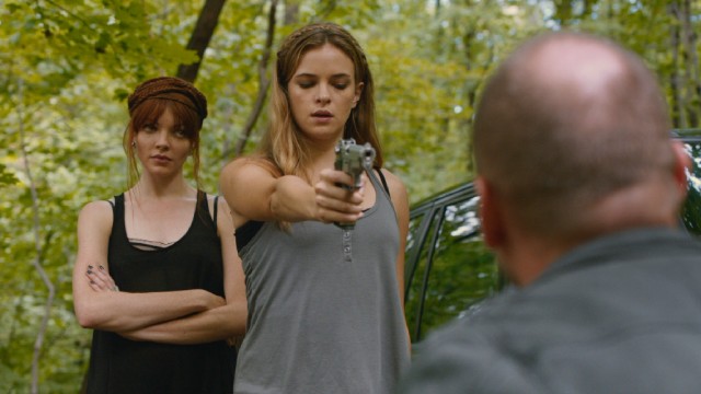 To the annoyance of jaded Lu (Nicole LaLiberte), Shae (Danielle Panabaker) hesitates to off her married boyfriend.