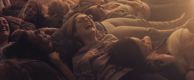 Gloria (Julianne Moore) shares a laugh with women in class.