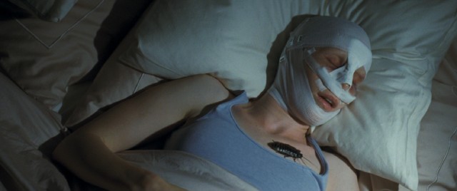 In what would likely be the film's most iconic shot, a large live cockroach is placed on the boys' sleeping, bandaged Mother (Susanne Wuest). Gross!