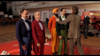 Wes Anderson inspects the colorful concierges of the Society of the Crossed Keys in "The Making of 'The Grand Budapest Hotel.'"