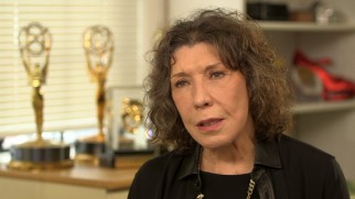 Multiple Emmy Awards are seen behind Lily Tomlin in her "Making 'Grandma'" interview.