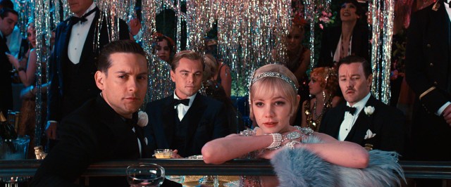 Nick (Tobey Maguire), Gatsby (Leonardo DiCaprio), Daisy (Carey Mulligan) and Tom (Joel Edgerton) take in the sights and sounds of one of Gatsby's spectacular parties in Baz Luhrmann's "The Great Gatsby" (2013).