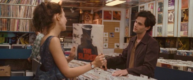 In "Greetings from Tim Buckley", Jeff Buckley (Penn Badgley) mockingly imitates every musical act Allie (Imogen Poots) points out to him in a record shop.